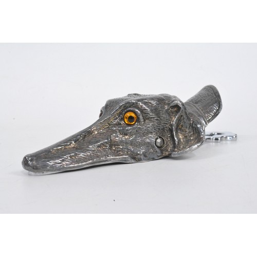 125 - Silver plated letter holder in  the form of a greyhound head, with glass eyes, length approx 15 cms