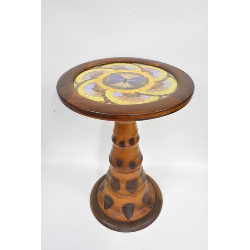 141 - Brazilian monkey puzzle tree wood, butterfly/moth wing occasional table, the circular top with an ar... 