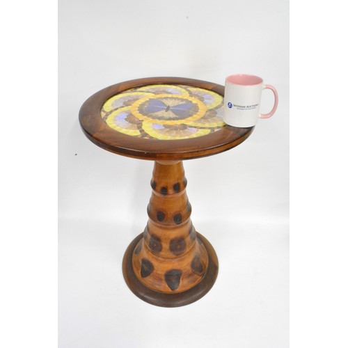 141 - Brazilian monkey puzzle tree wood, butterfly/moth wing occasional table, the circular top with an ar... 