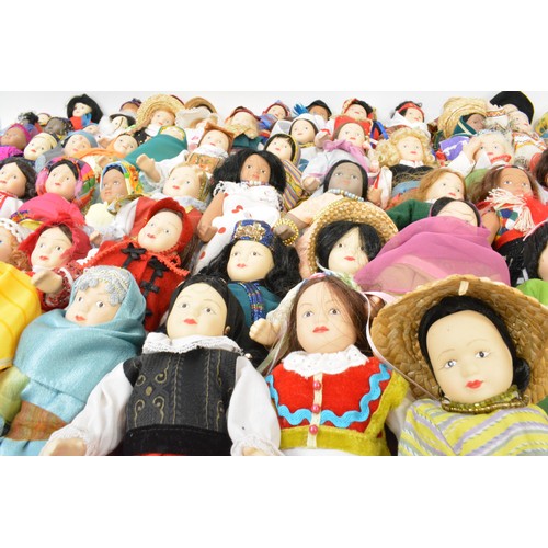 176 - A group of vintage porcelain dolls, in tradtional attire.