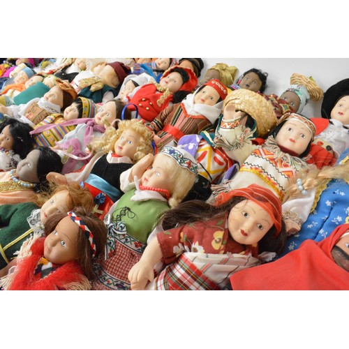 176 - A group of vintage porcelain dolls, in tradtional attire.