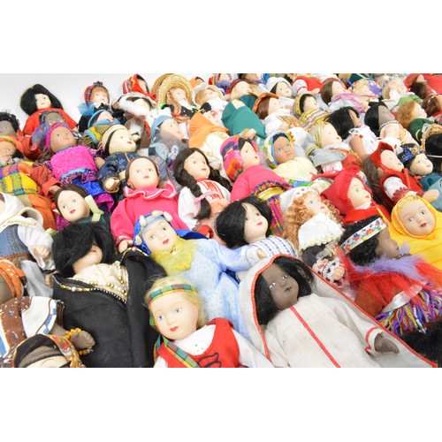 176 - A group of vintage porcelain dolls, in tradtional attire.