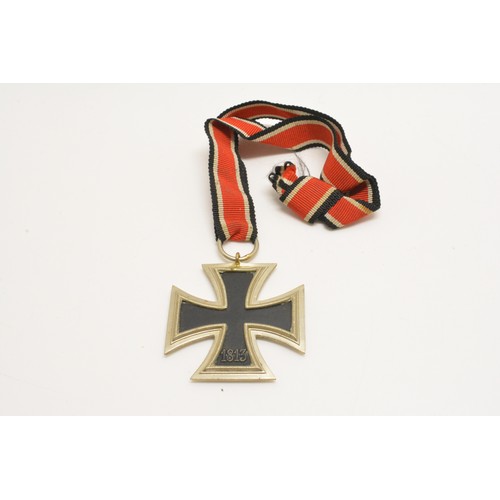 251 - WW2 German Military iron cross with ribbon