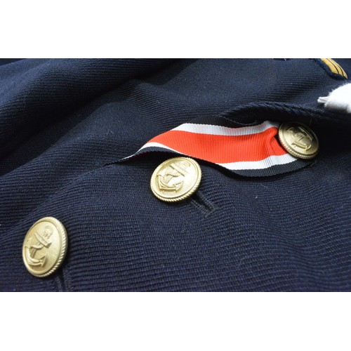 256 - WW2 German clothing items consisting; Kriegsmarine Leiutenant's blue tunic complete with insignia br... 