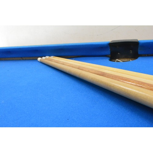 269 - Modern children's pool table. Veneered pine with a blue baize and detachable legs, measuring 44