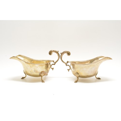 278 - A pair of antique silver sauce boats, both on three pad feet with beaded rim, Hallmarked Birmingham,... 