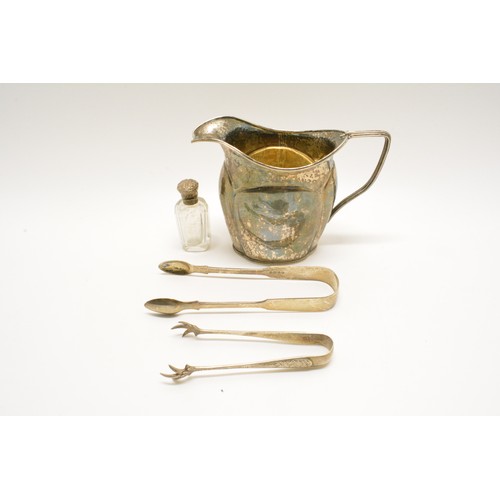 279 - Small group of silver items consisting; jug (unmarked tested as silver), sugar tongs one having claw... 