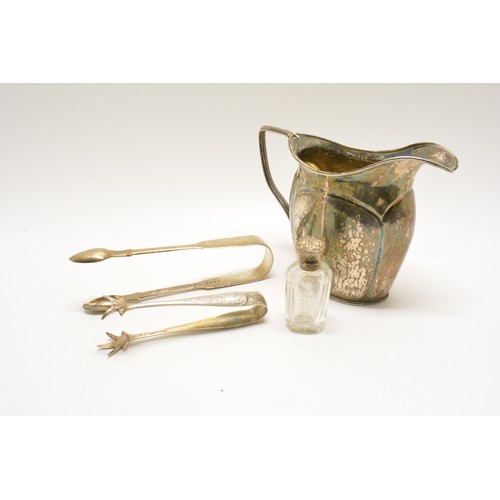 279 - Small group of silver items consisting; jug (unmarked tested as silver), sugar tongs one having claw... 