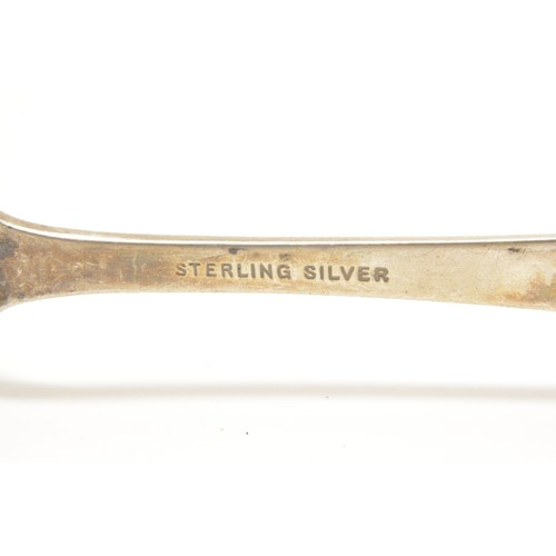 279 - Small group of silver items consisting; jug (unmarked tested as silver), sugar tongs one having claw... 