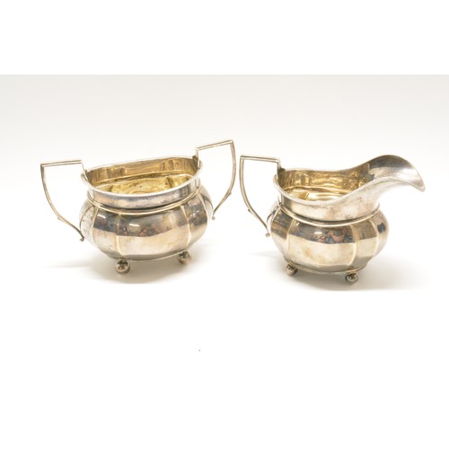 286 - Adie Brothers three piece silverware teaset consisting of a teapot dated 1928-9, milk jug, twin hand... 