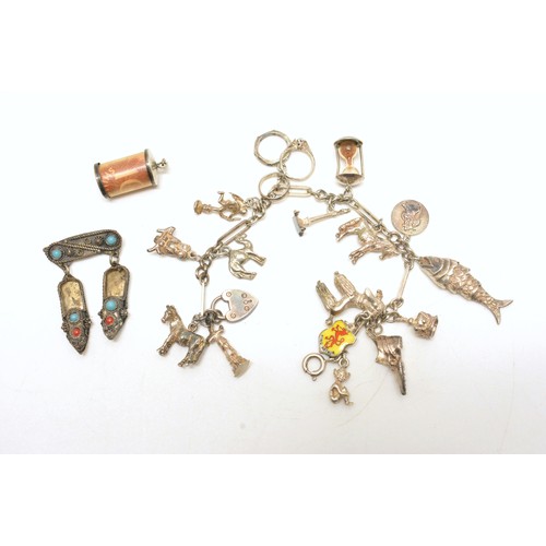 331 - Vintage hallmarked silver charm bracelet with 16 charms, together with £10 shillings note encased in... 