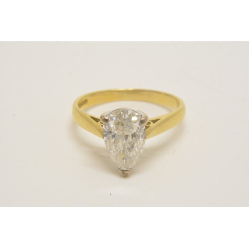 337 - 18ct yellow gold solitaire ring set with a pear shaped diamond, approx 1.50ct, set in an 18ct white ... 