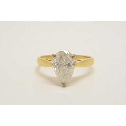 337 - 18ct yellow gold solitaire ring set with a pear shaped diamond, approx 1.50ct, set in an 18ct white ... 