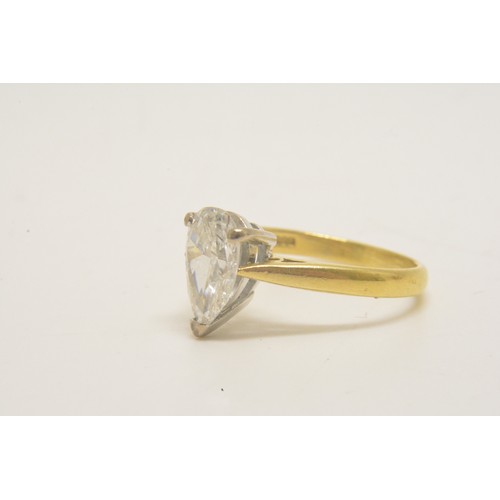 337 - 18ct yellow gold solitaire ring set with a pear shaped diamond, approx 1.50ct, set in an 18ct white ... 