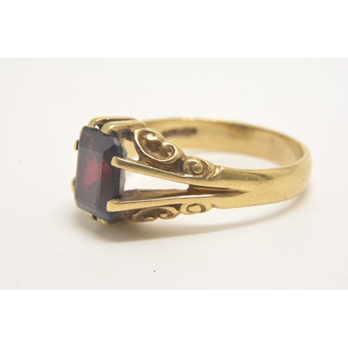 340 - A ladies gold dress ring with a square Garnet stone marked 375 size T-U weight 4.8grams