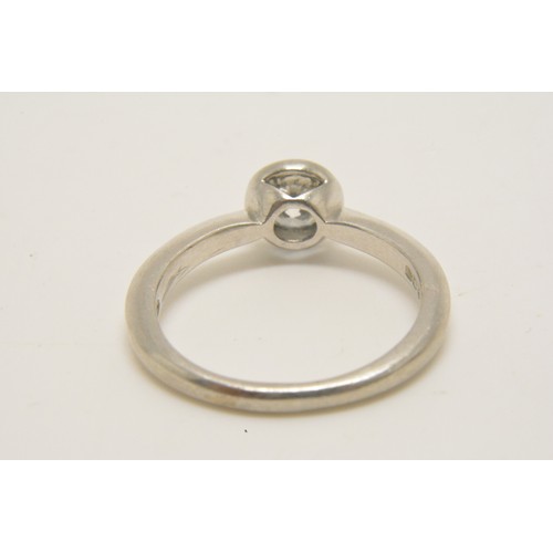 345 - Platinum solitaire ring set with a round brilliant cut diamond ina rub over setting, diamond weight ... 