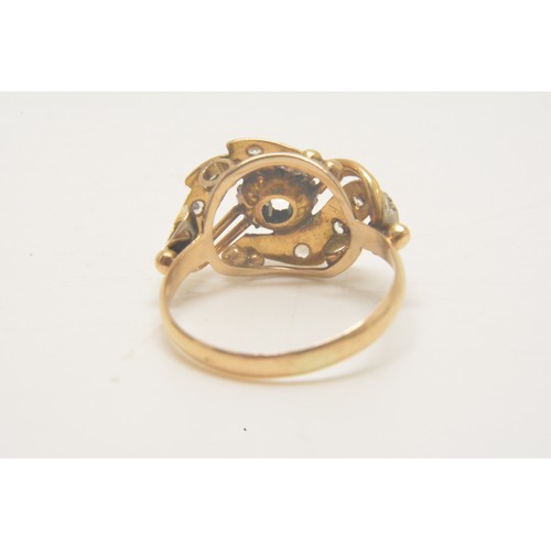 349 - 9ct yellow gold  ring with clear stones in swirl design. approx. size J.