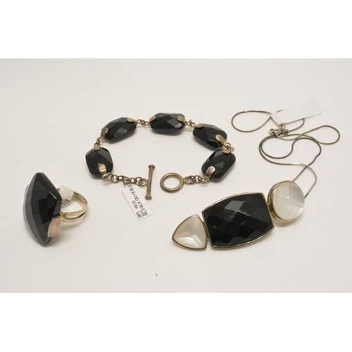 367 - Silver faceted black agate ring, with bracelet  and necklace, all stamped 925, new with tag