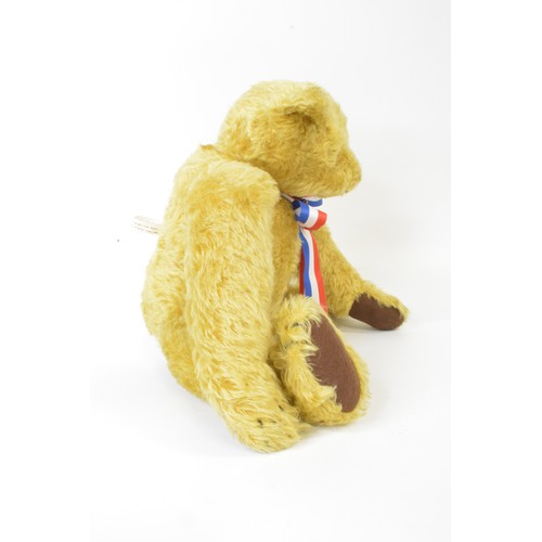 36 - Honey coloured bear with union jack colours neck tie with badge, height 43 cms [17