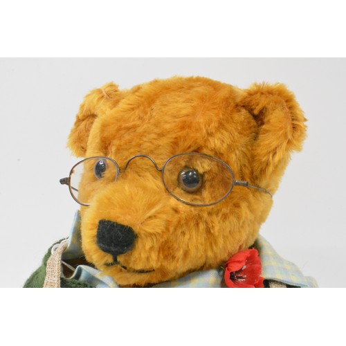 47 - B.M.Beardwell dressed 'Gardener' bear with glasses holding a basket of fruit, size 43cms [17