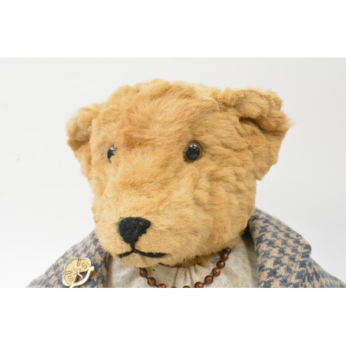 53 - Designed and made by B.M.Beardwell  bear with dress, blue tweed coat and blue shoes and necklace, he... 