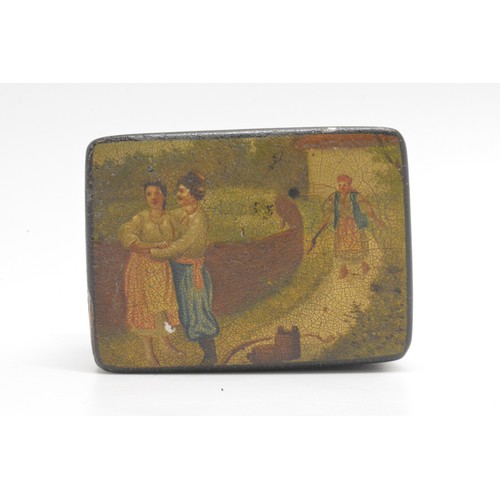 104 - Antique papier mache lacquered snuff box with scene depicting courting couple on a walk