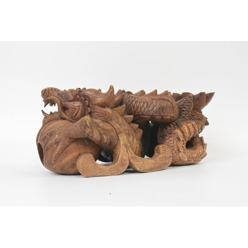 106 - Hand carved Chinese dragon figure, approx L31cm