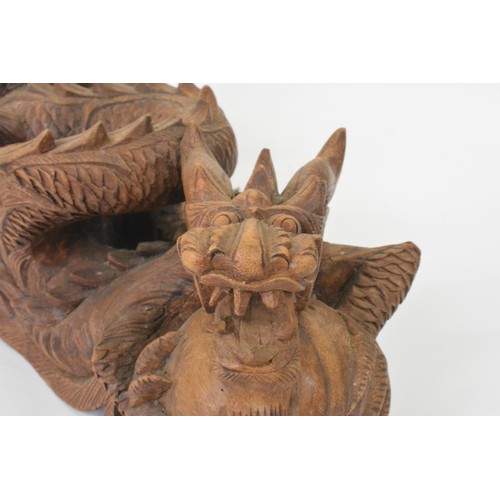 106 - Hand carved Chinese dragon figure, approx L31cm