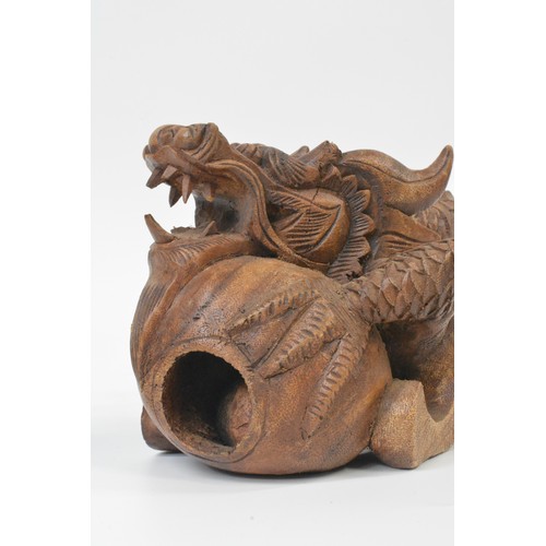 106 - Hand carved Chinese dragon figure, approx L31cm