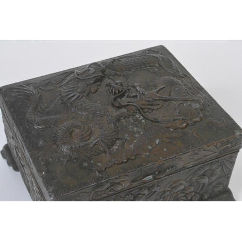 109 - Oriental jewellery box with dragon design to top and floral decoration to sides