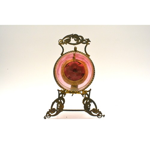 115 - Antique pocket watch display case, cranberry glass with bevelled edge, Ormolu design to stand. Appro... 