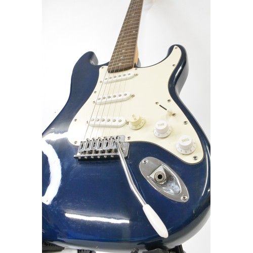 130 - Gear 4 Music six string electric blue guitar with carrier and Microphone (stand not included, no cab... 