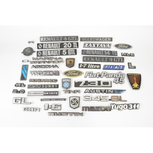 133 - Selection of car badges to include Ford, Rover, Volkswagen, Mini, Datsun Sunny, etc