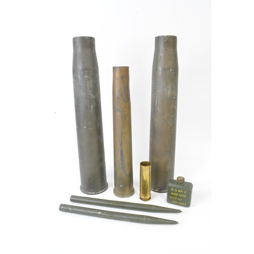 147 - Military Interest - Group of artillery shell casings mixed size and oil can marked M G Mk3 BSM 1973