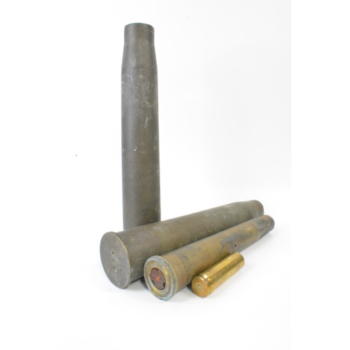 147 - Military Interest - Group of artillery shell casings mixed size and oil can marked M G Mk3 BSM 1973