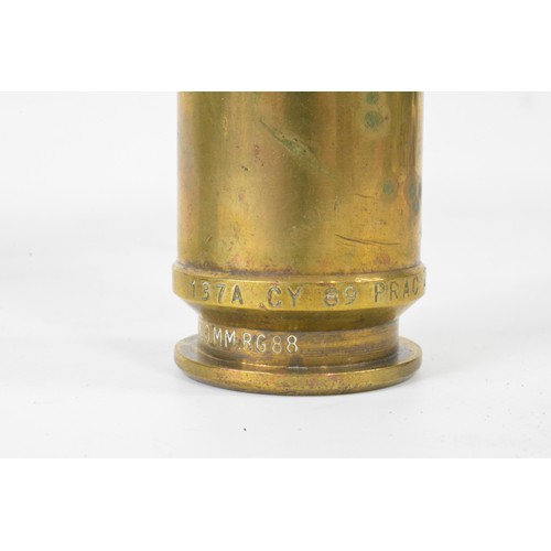 147 - Military Interest - Group of artillery shell casings mixed size and oil can marked M G Mk3 BSM 1973