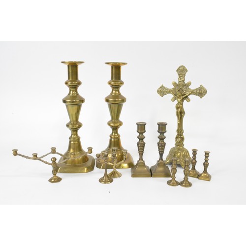 153 - Vintage brass crucifix with Corpus Christie and INRI to top 24cm together with mixed candlesticks va... 