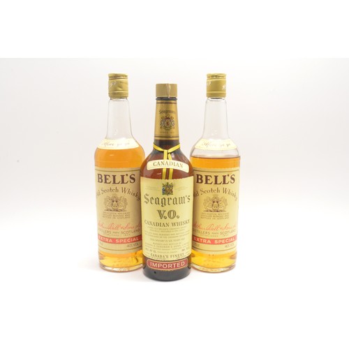 211 - Three bottles-1 Seagram's V.O. Canadian whisky, 70cl, 40% and 2 Bell's Extra Special, 75cl,40%, 1980... 