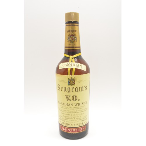 211 - Three bottles-1 Seagram's V.O. Canadian whisky, 70cl, 40% and 2 Bell's Extra Special, 75cl,40%, 1980... 