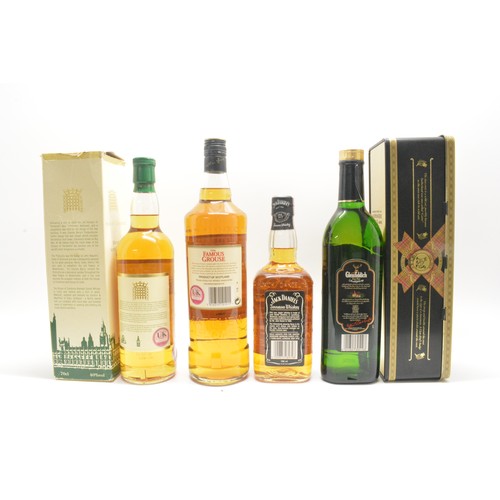 229 - One bottle tubed Glenfiddich,70cl,40%,1990, one litre The Famous Grouse,40%, 1990, one bottle Jack D... 