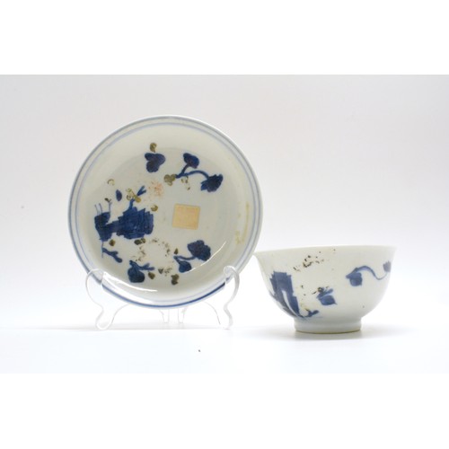 247 - AN 18TH CENTURY CHINESE PORCELAIN NANKING CARGO TEA BOWL AND SAUCER. Hand-painted flowers/ pavillion... 