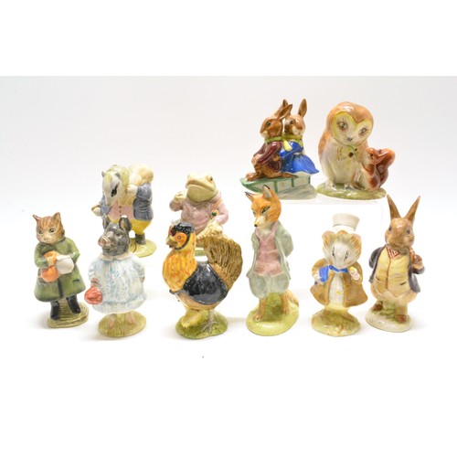 251 - A group of x10 Beatrix Potter/Bunnykin figures by Beswick, Royal Doulton etc. to incl. Pig Wig, Foxy... 