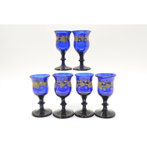 273 - Cobalt blue glasses (x6) with gilded vine decoration together with Georgian Bristol blue 'soy' condi... 