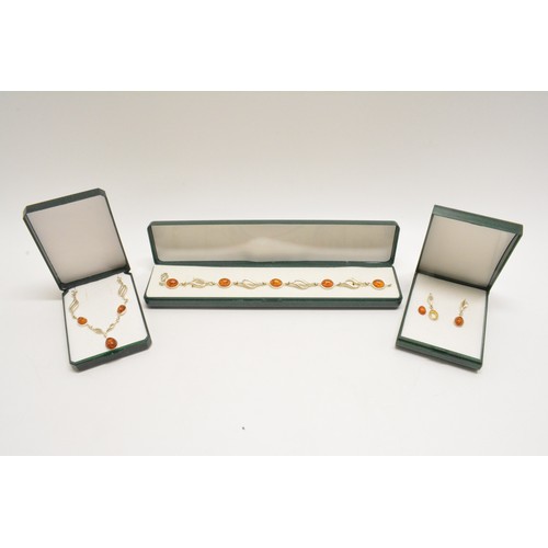 303 - Silver and amber necklace, bracelet and earrings stamped 925, all with boxes.