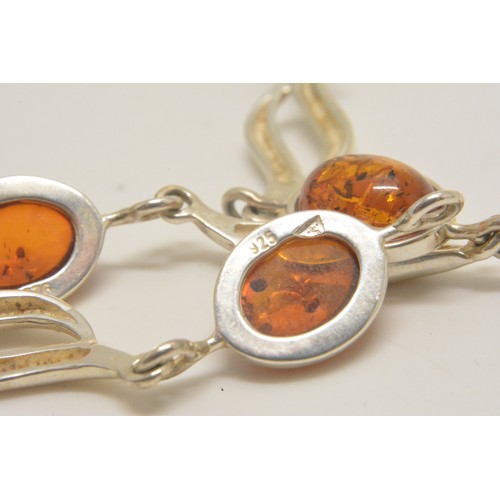 303 - Silver and amber necklace, bracelet and earrings stamped 925, all with boxes.