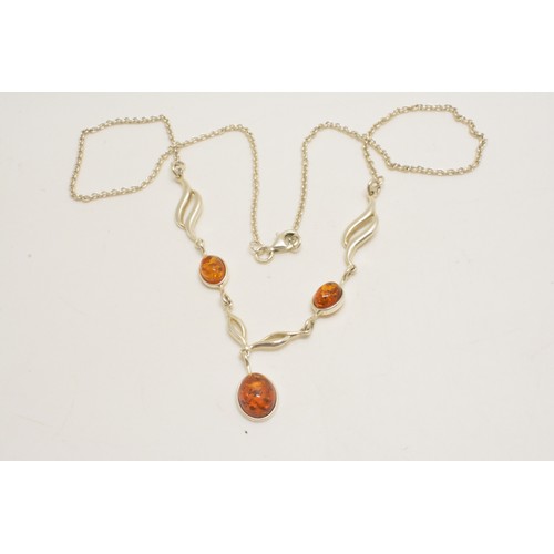 303 - Silver and amber necklace, bracelet and earrings stamped 925, all with boxes.