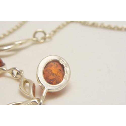 303 - Silver and amber necklace, bracelet and earrings stamped 925, all with boxes.