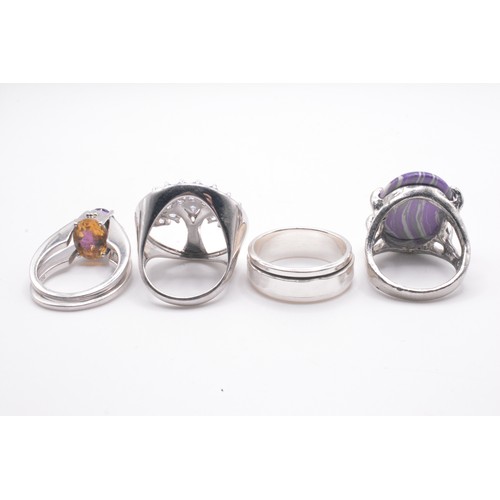 308 - x4 rings, predominately stamped 925. One flip ring with purple/yellow stones, Sizes O-Q.