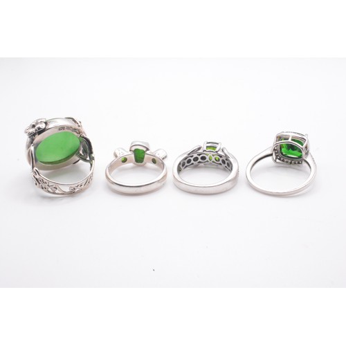 309 - Group of x4 green stone rings varying in design, mostly marked 925. Size range N-R.