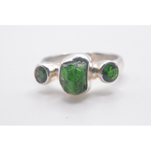 309 - Group of x4 green stone rings varying in design, mostly marked 925. Size range N-R.